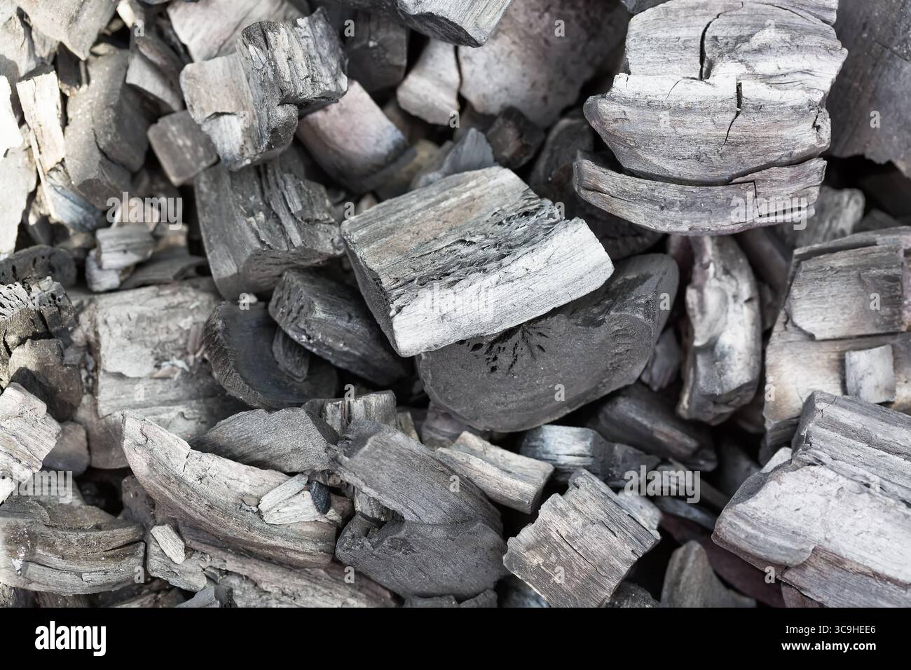 Black charcoal background with selective focus close up.. Stock Photo