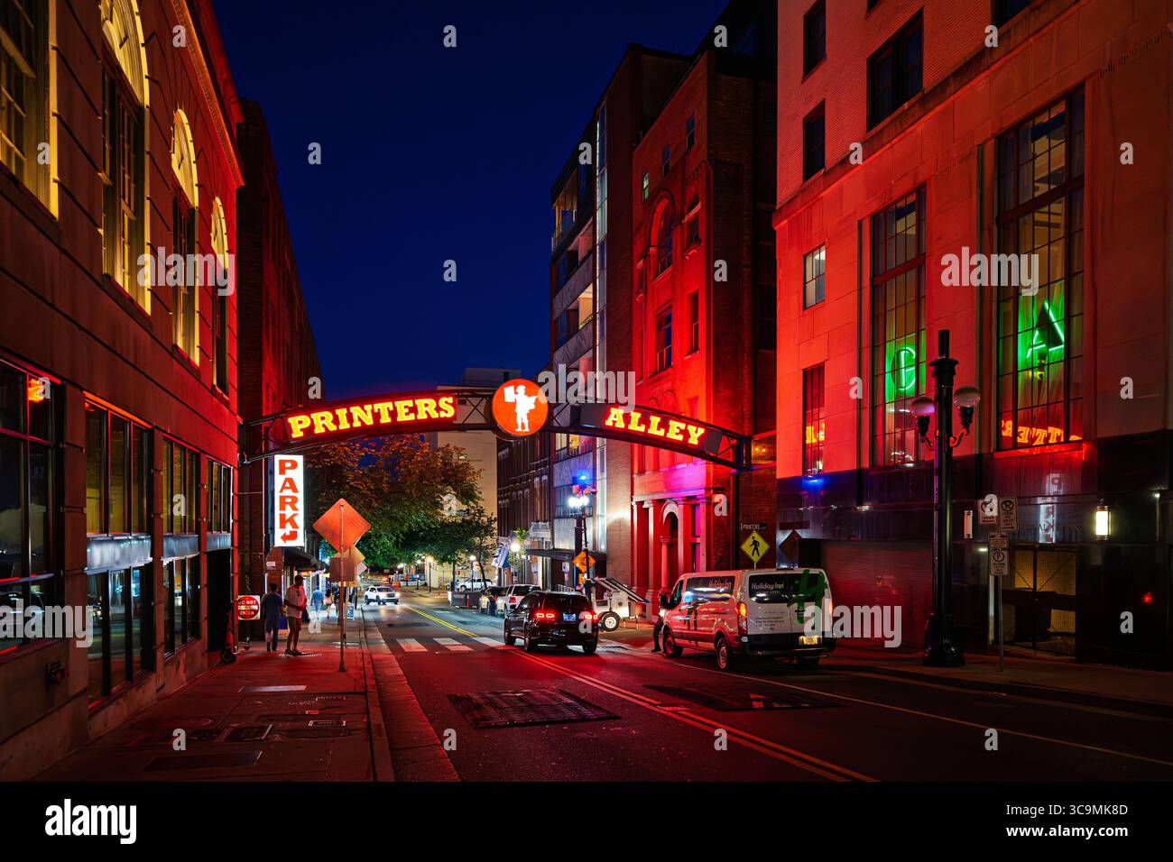 Night view of the entrance sign to Printers Alley, a historic alleyway in downtown Nashville, Tennessee, known for it's vibrant nightlife. Stock Photo