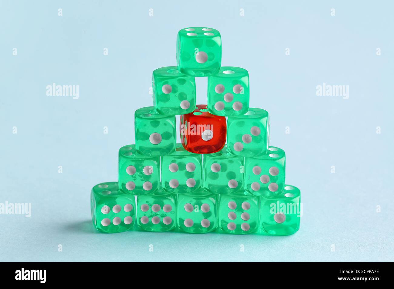 Stack of game dices on blue background Stock Photo