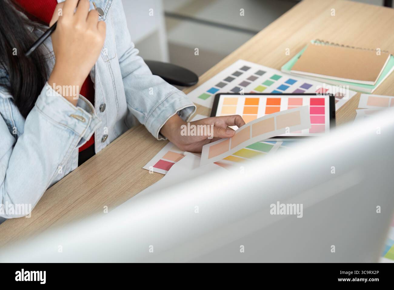 Creative Designer Reviewing Color Samples on Tablet Stock Photo - Alamy