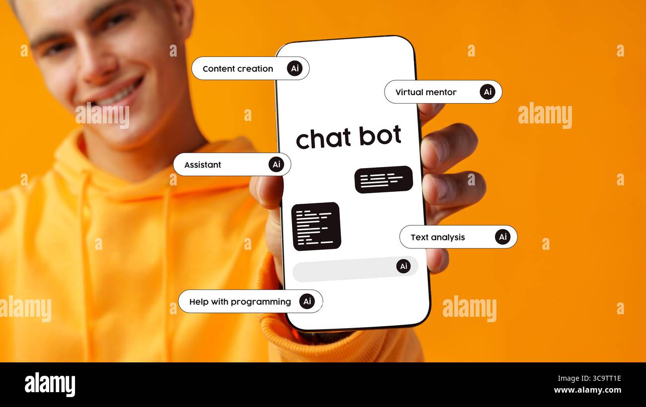 Young man showcasing a smartphone displaying a chatbot interface and features with a vibrant orange background Stock Photo