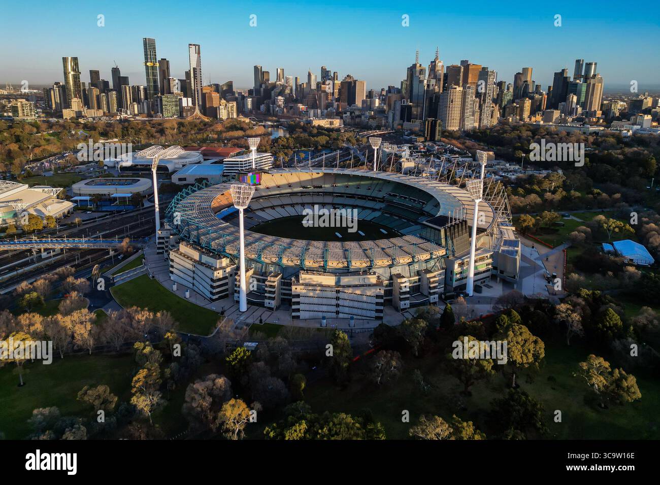The Melbourne Cricket Ground MCG can be seen at sunrise, in front of ...