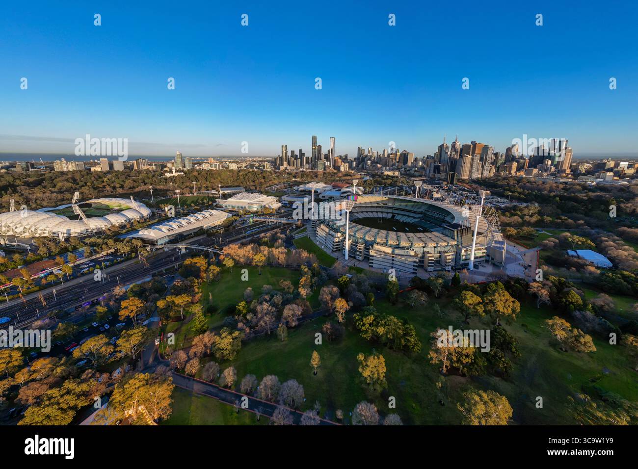 The Melbourne Cricket Ground MCG can be seen at sunrise, in front of ...