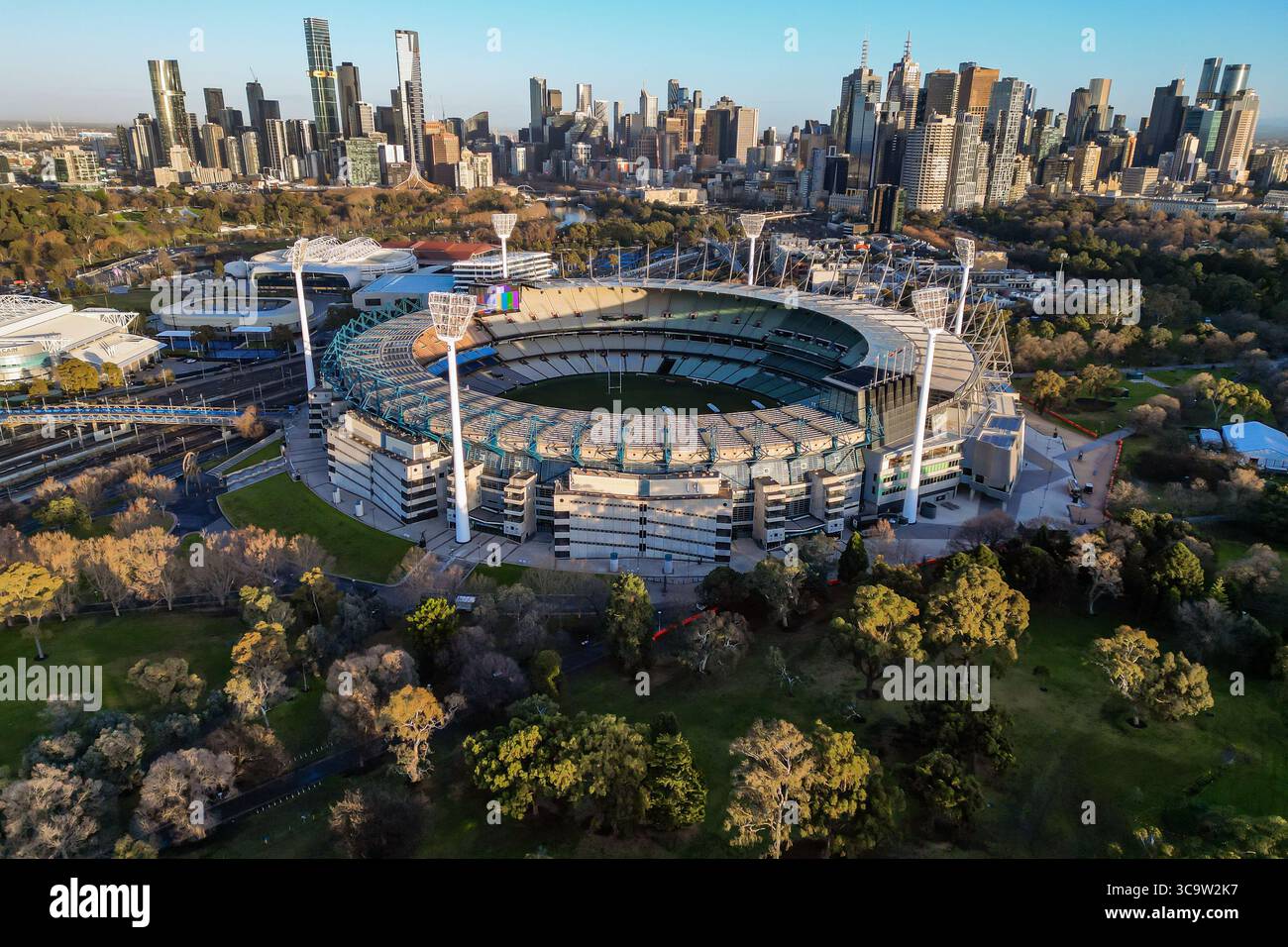 The Melbourne Cricket Ground MCG can be seen at sunrise, in front of ...