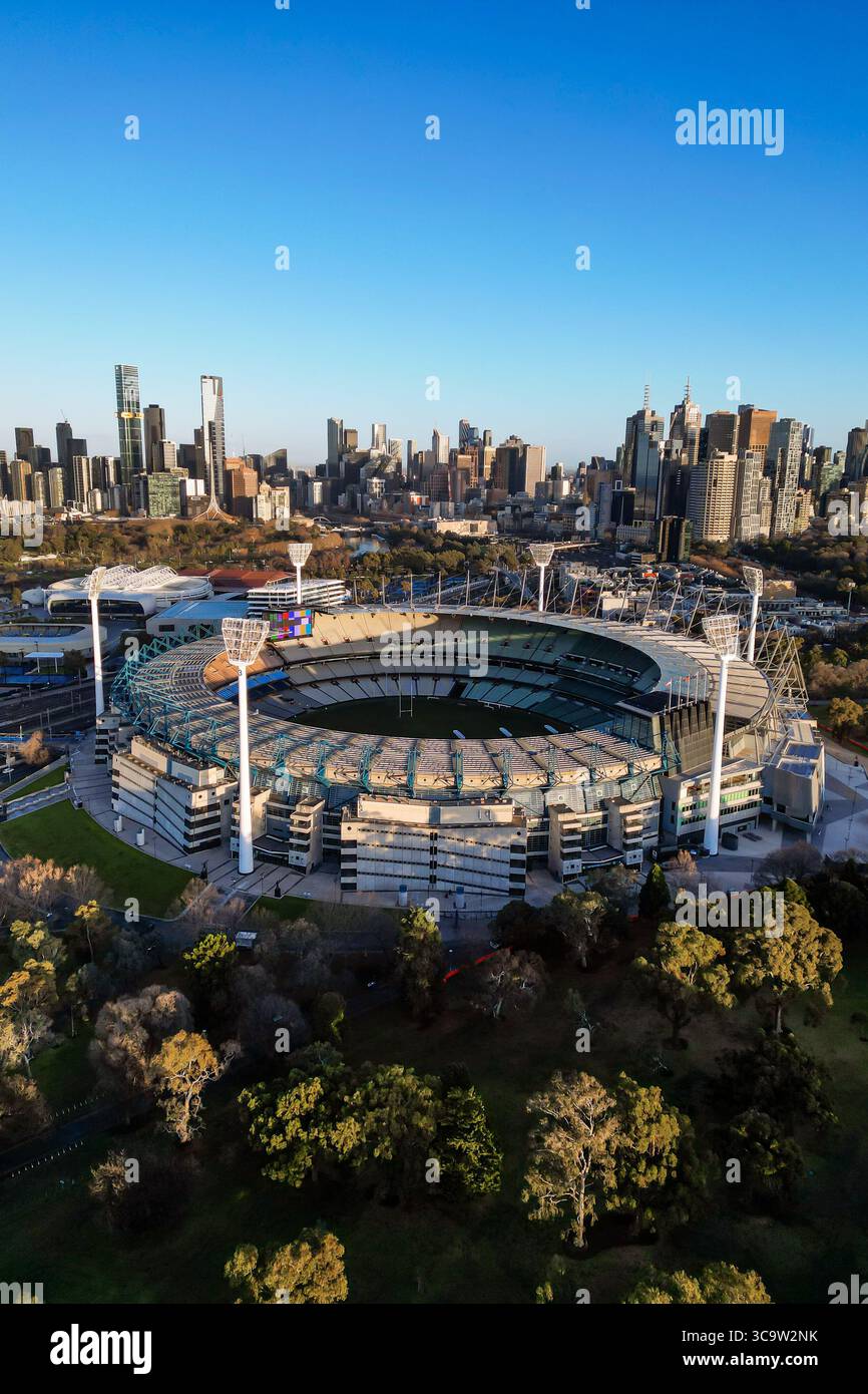 The Melbourne Cricket Ground MCG can be seen at sunrise, in front of ...