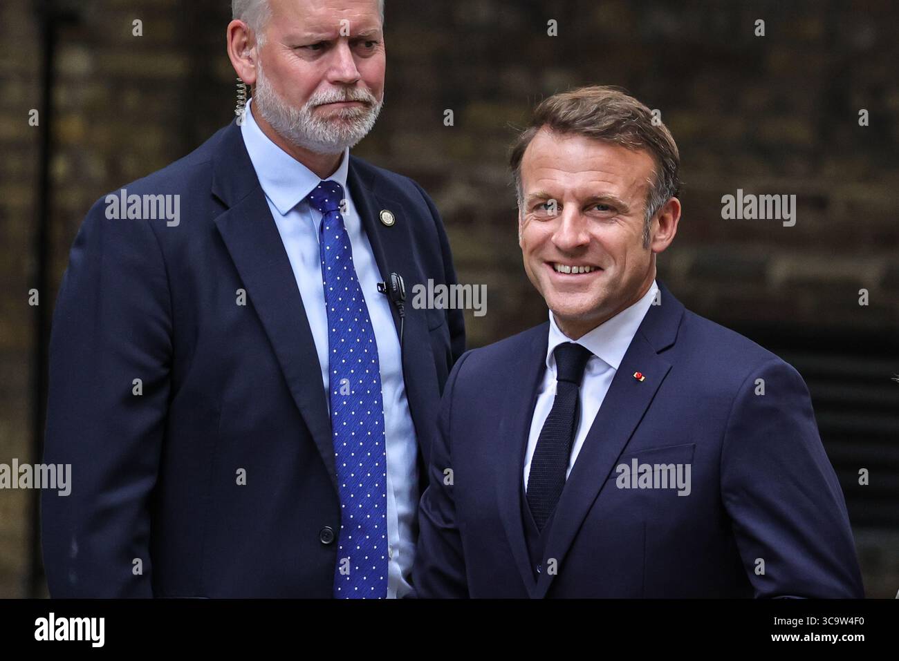 President of France Emmanuel Macron walks up Downing Street, London during a State Visit to the UK Stock Photo