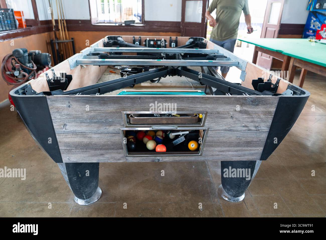 Pool table repair in a cafe Stock Photo