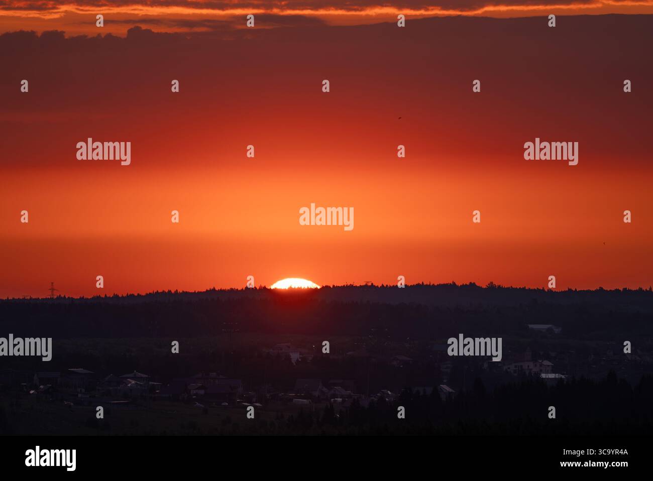Rising sun illuminating the sky with vibrant shades of orange and red ...