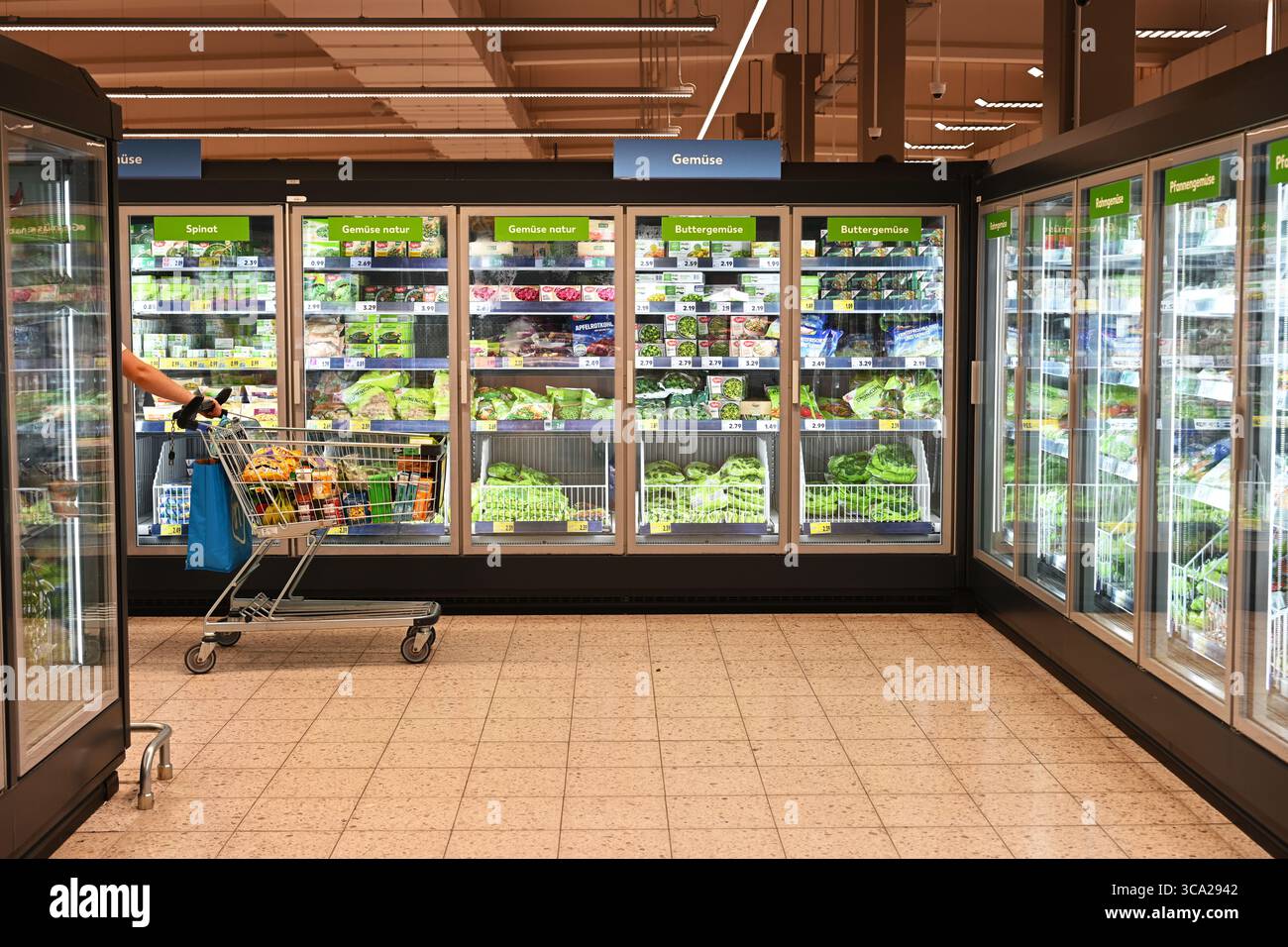 packaged frozen vegetables in supermarket freezers Stock Photo