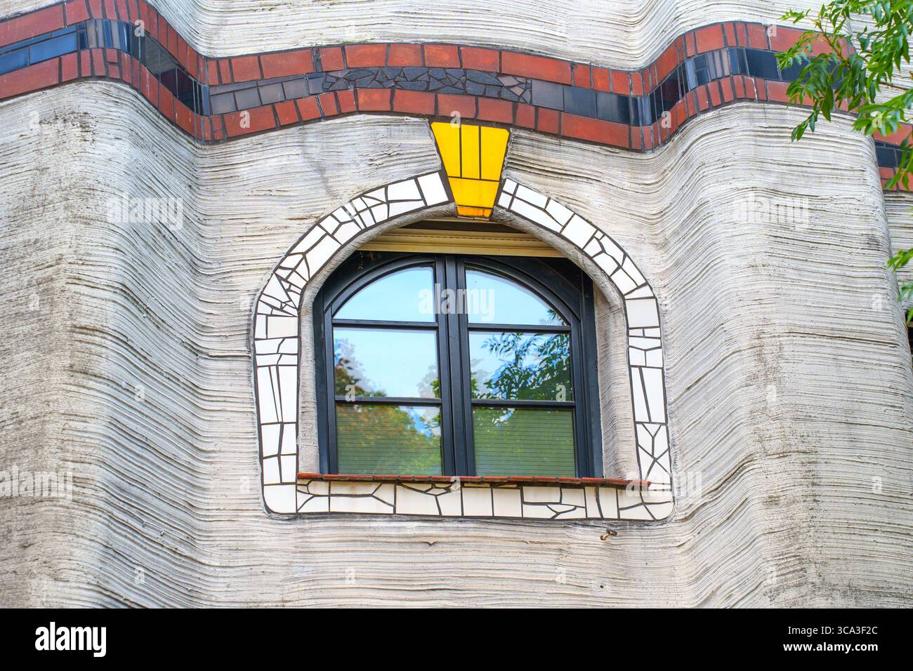 Decorative window frame with colorful mosaic elements in the ...