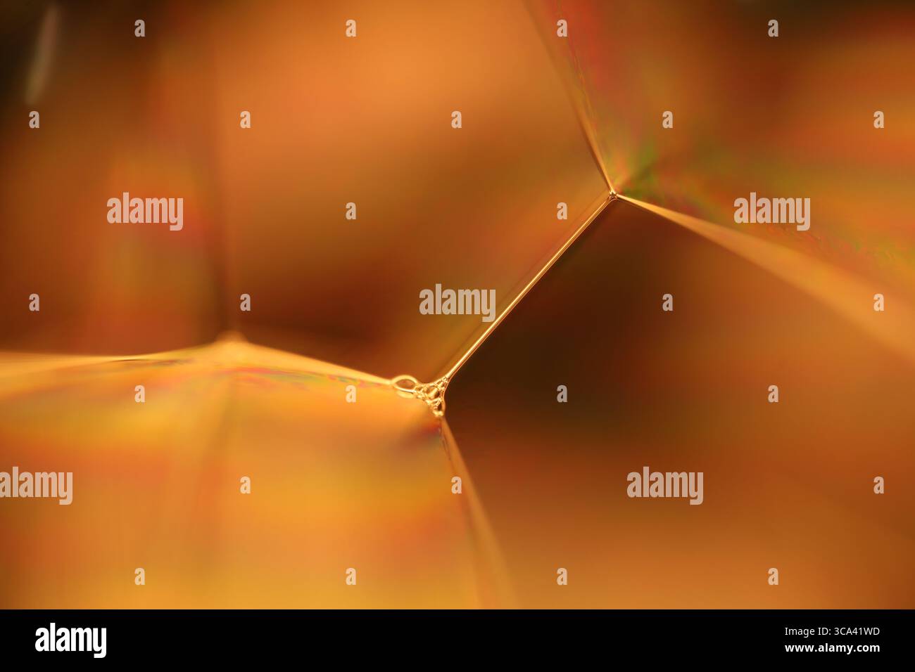 Orange coloured liquid surface, fluid effect, bright chemistry, geometric shapes Stock Photo