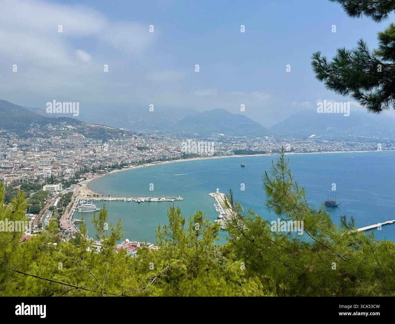 Photo is taken this year summer in Alanya Turkey. Beach, Mare and plants are visible. Blue sky with few clouds. Sunny and warm - Smartphone Captured Stock Image