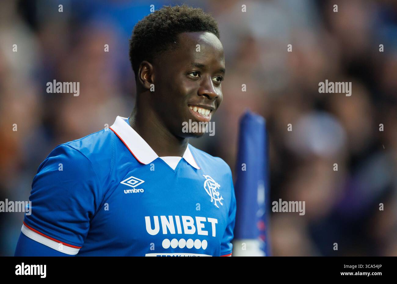 Rangers' goalscorer Djeidi Gassama celebrates his teams 3rd goal during the UEFA Champions League Third Qualifying round  match at Ibrox Stadium, Glas Stock Photo