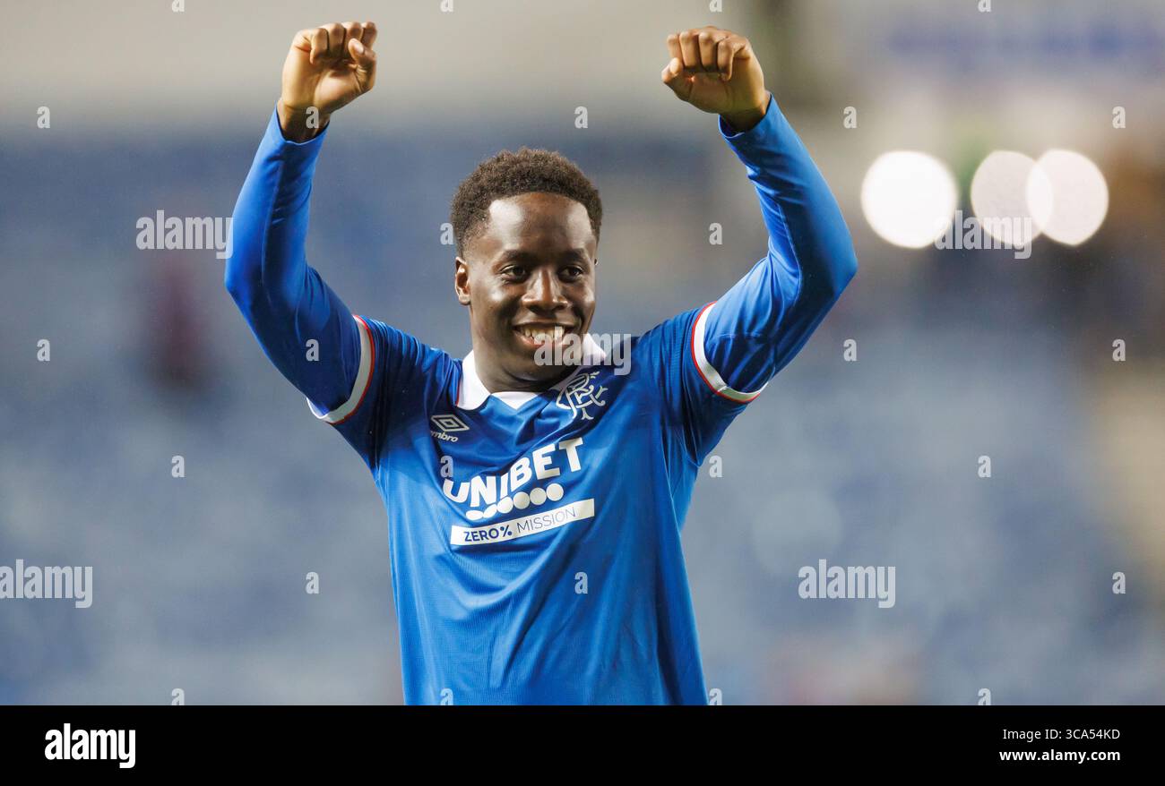 Rangers' goalscorer Djeidi Gassama celebrates after the UEFA Champions League Third Qualifying round  match at Ibrox Stadium, Glasgow. Picture date: T Stock Photo