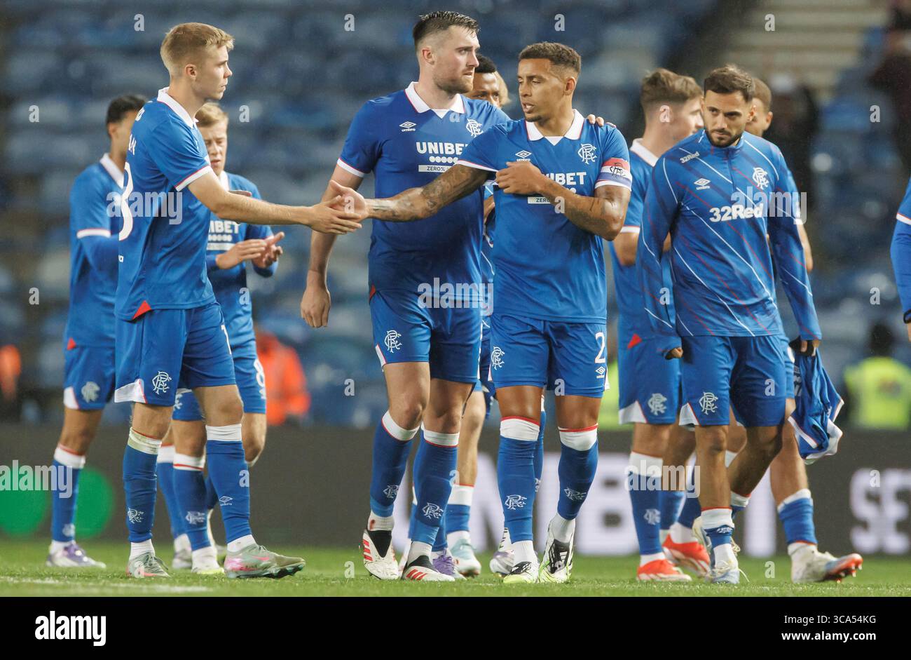 Rangers' James Tavernier celebrates with teammate Oliver Antman after the UEFA Champions League Third Qualifying round  match at Ibrox Stadium, Glasgo Stock Photo