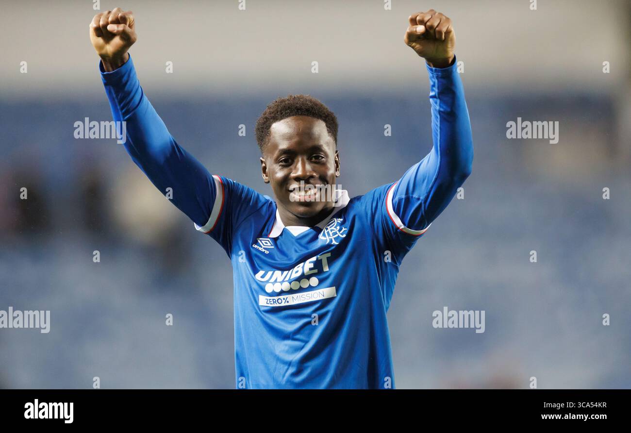 Rangers' goalscorer Djeidi Gassama celebrates after the UEFA Champions League Third Qualifying round  match at Ibrox Stadium, Glasgow. Picture date: T Stock Photo