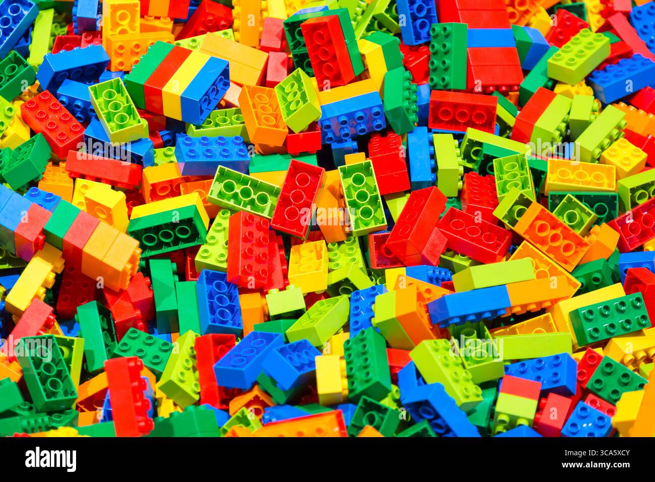 Plastic toy blocks erector set for children as a background. Selective focus. Stock Photo