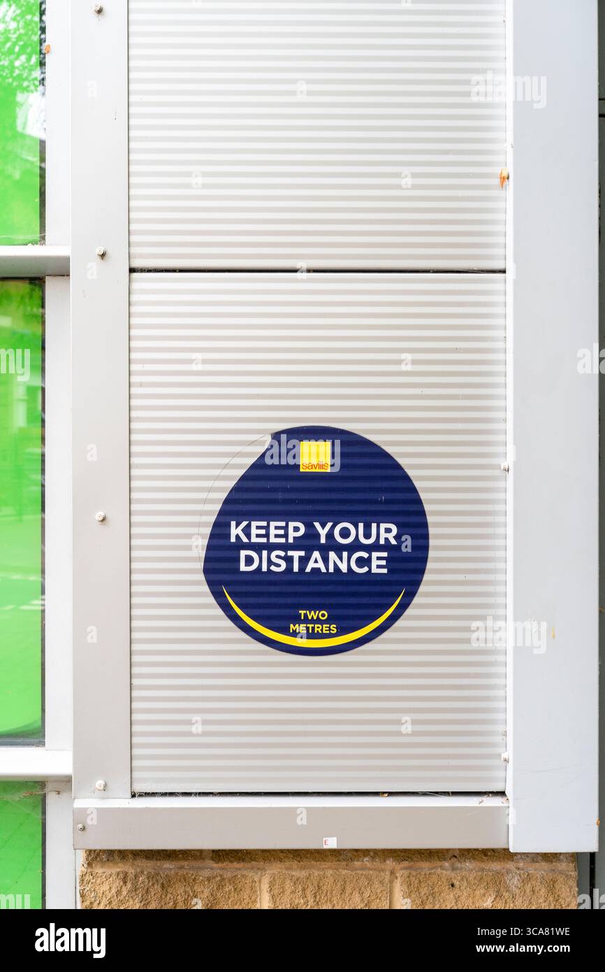 Old Covid keep your distance sign Stock Photo