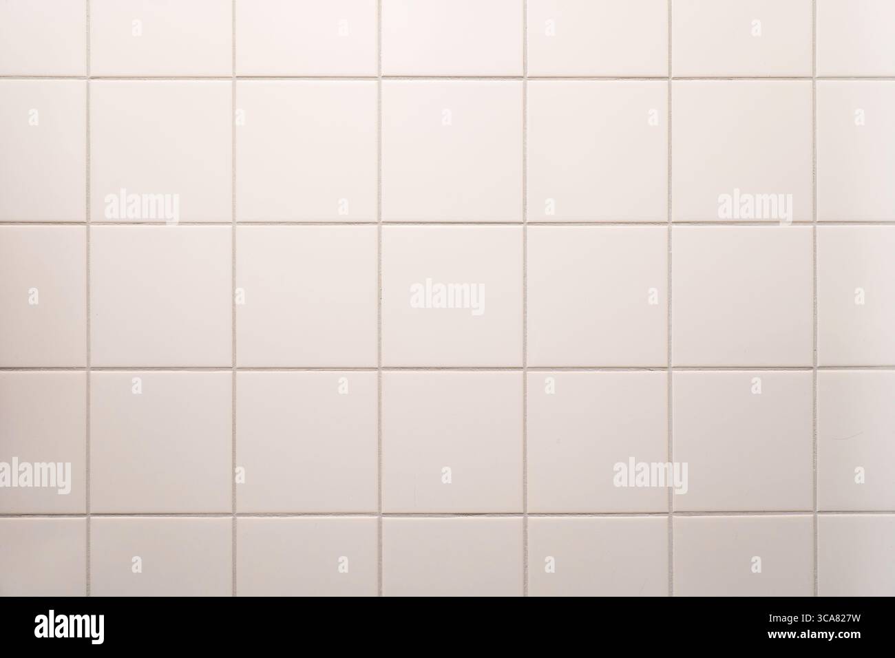 white tiled wall in the bathroom Stock Photo