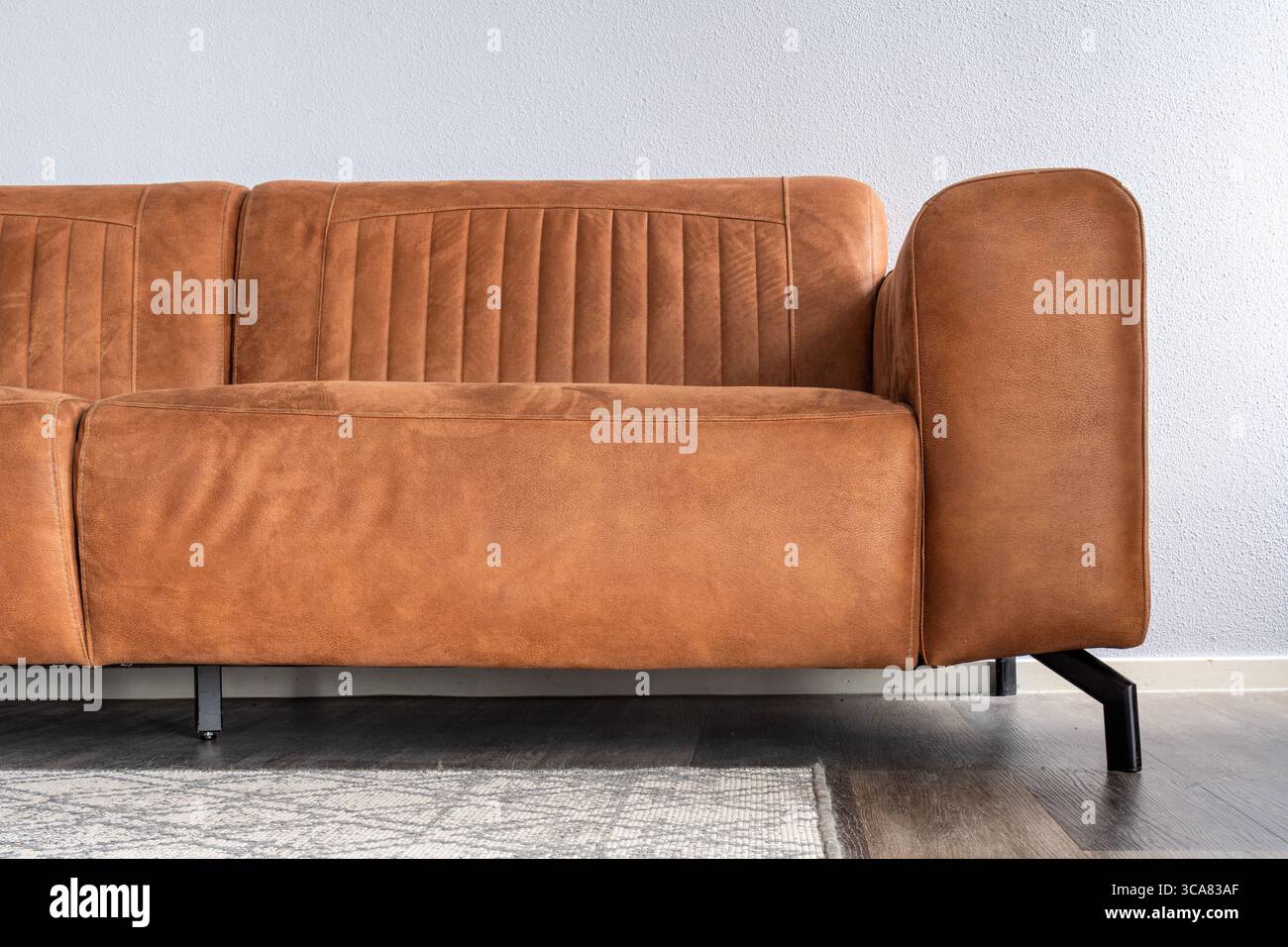 brown leather sofa in apartment Stock Photo
