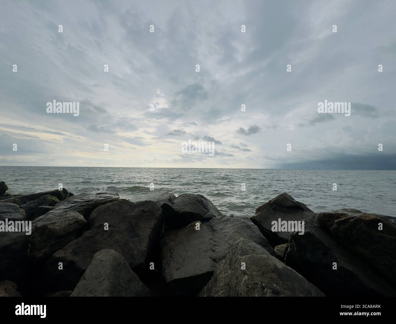 Browns Beach in Negombo, Sri Lanka, glows with golden sands and stunning sunsets over calm waters, perfect for relaxation and beach strolls. - Smartphone Captured Stock Image