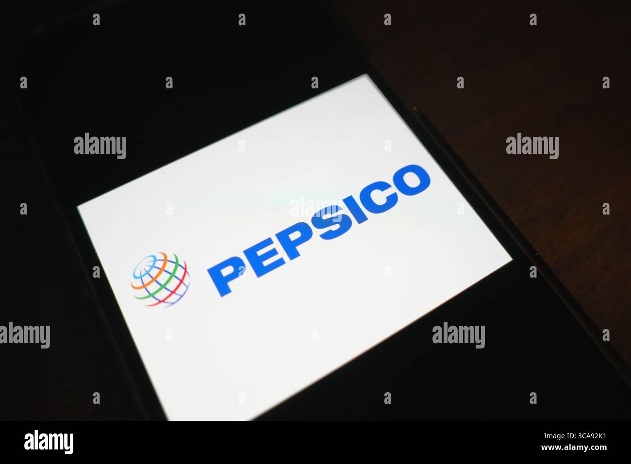 Roosendaal, The Netherlands - August 06, 2025: A mobile phone displaying the company logo of Pepsico. Stock Photo