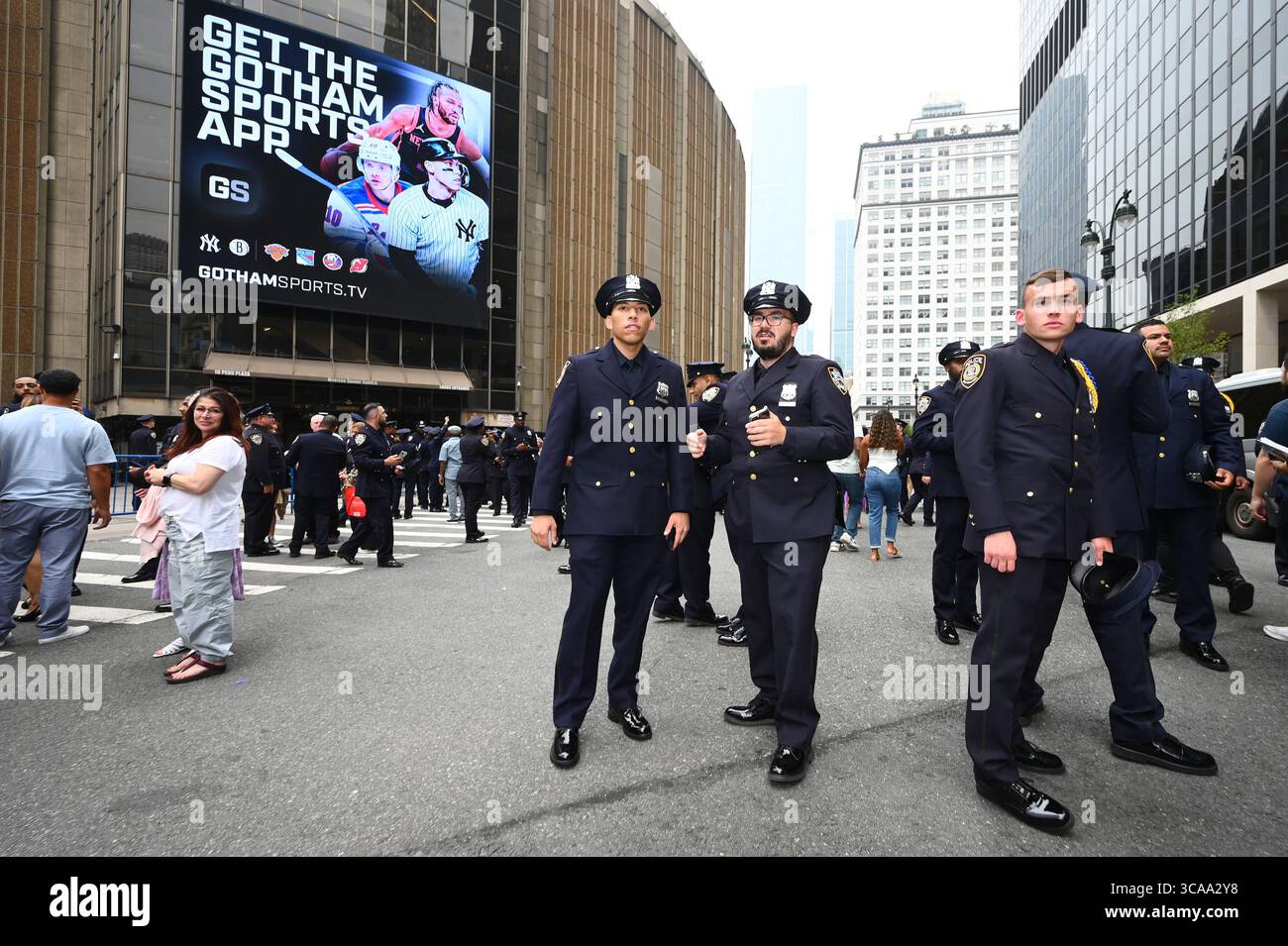 Newly sworn-in New York City Police Officers pose for pictures with ...