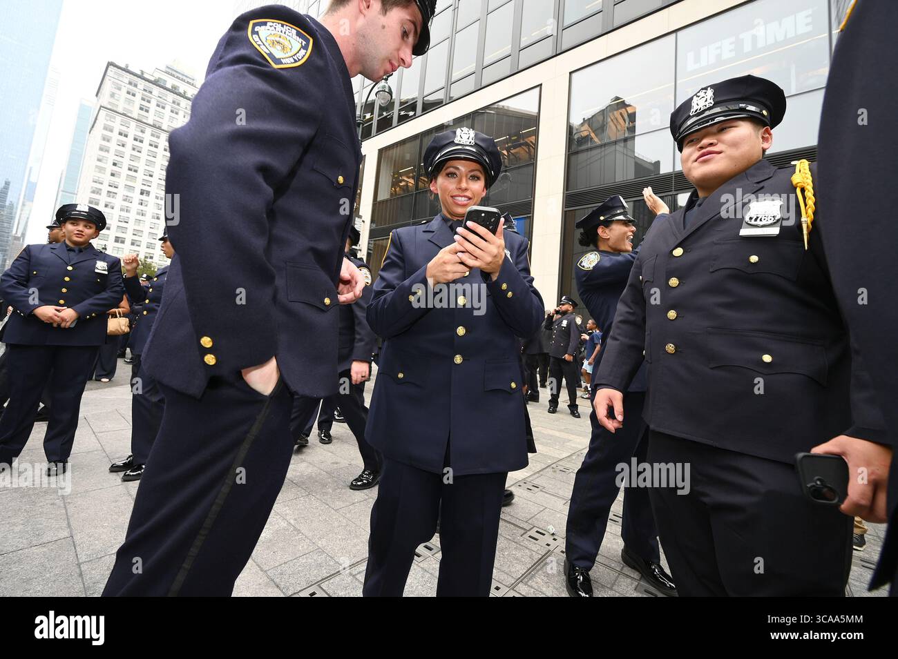 Newly sworn-in New York City Police Officers pose for pictures with ...