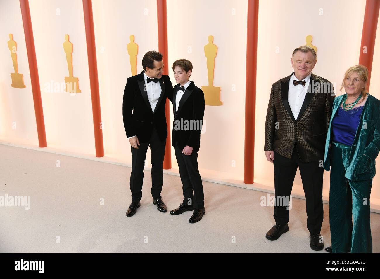 March 12, 2023, Los Angeles, California, USA: COLIN FARRELL and HENRY TADEUSZ FARRELL with BRENDAN and wife MARY GLEESON at right, during red carpet arrivals for the 95th Academy Awards, presented by the Academy of Motion Picture Arts and Sciences (AMPAS), at the Dolby Theatre in Hollywood. (Credit Image: © Kevin Sullivan/ZUMA Press Wire) Stock Photo