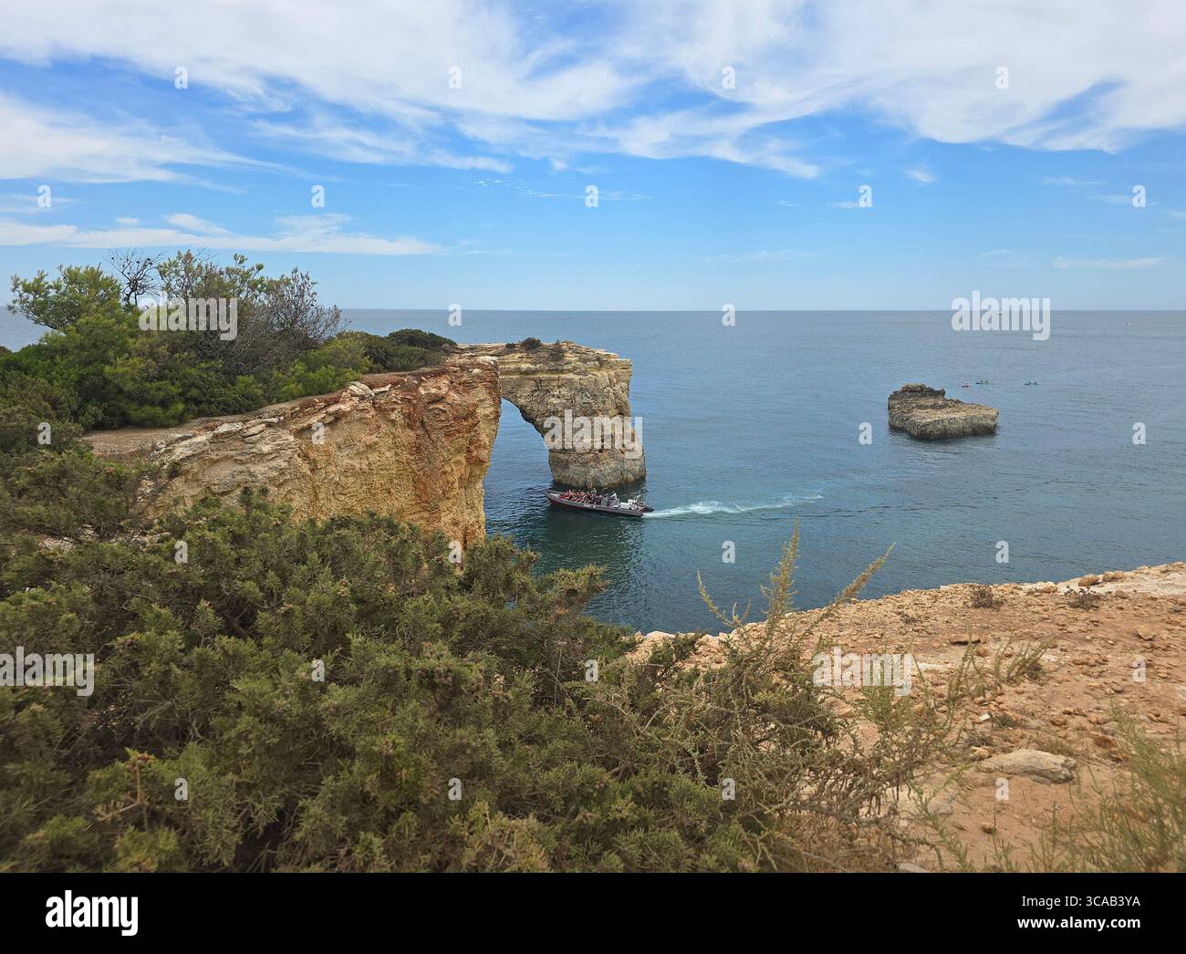 Albufeira coastal hiking trail along the dramatic cliffs and rock formations of the Algarve, Portugal, with stunning views over the Atlantic Ocean. - Smartphone Captured Stock Image