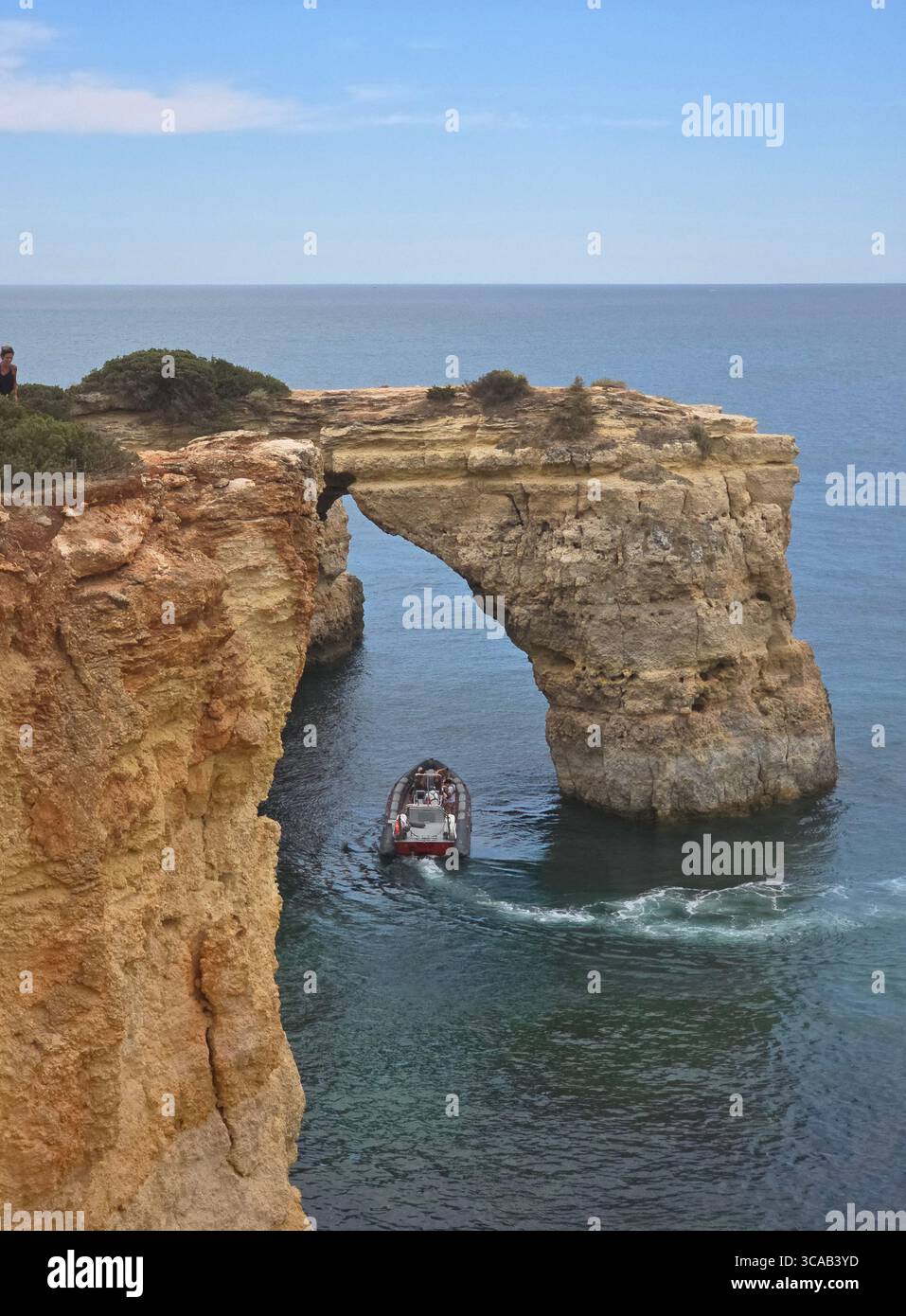 Albufeira coastal hiking trail along the dramatic cliffs and rock formations of the Algarve, Portugal, with stunning views over the Atlantic Ocean. - Smartphone Captured Stock Image