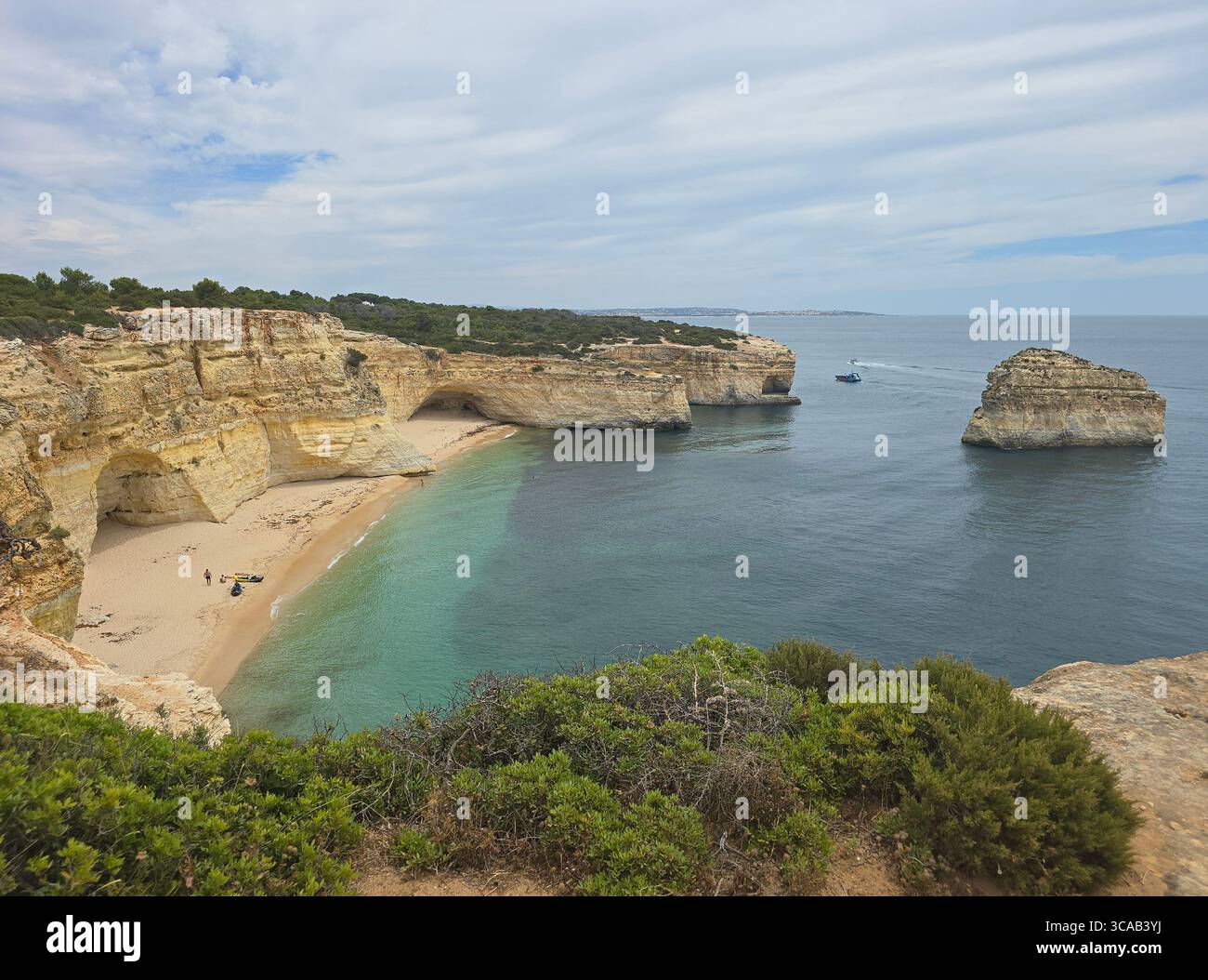 Albufeira coastal hiking trail along the dramatic cliffs and rock formations of the Algarve, Portugal, with stunning views over the Atlantic Ocean. - Smartphone Captured Stock Image