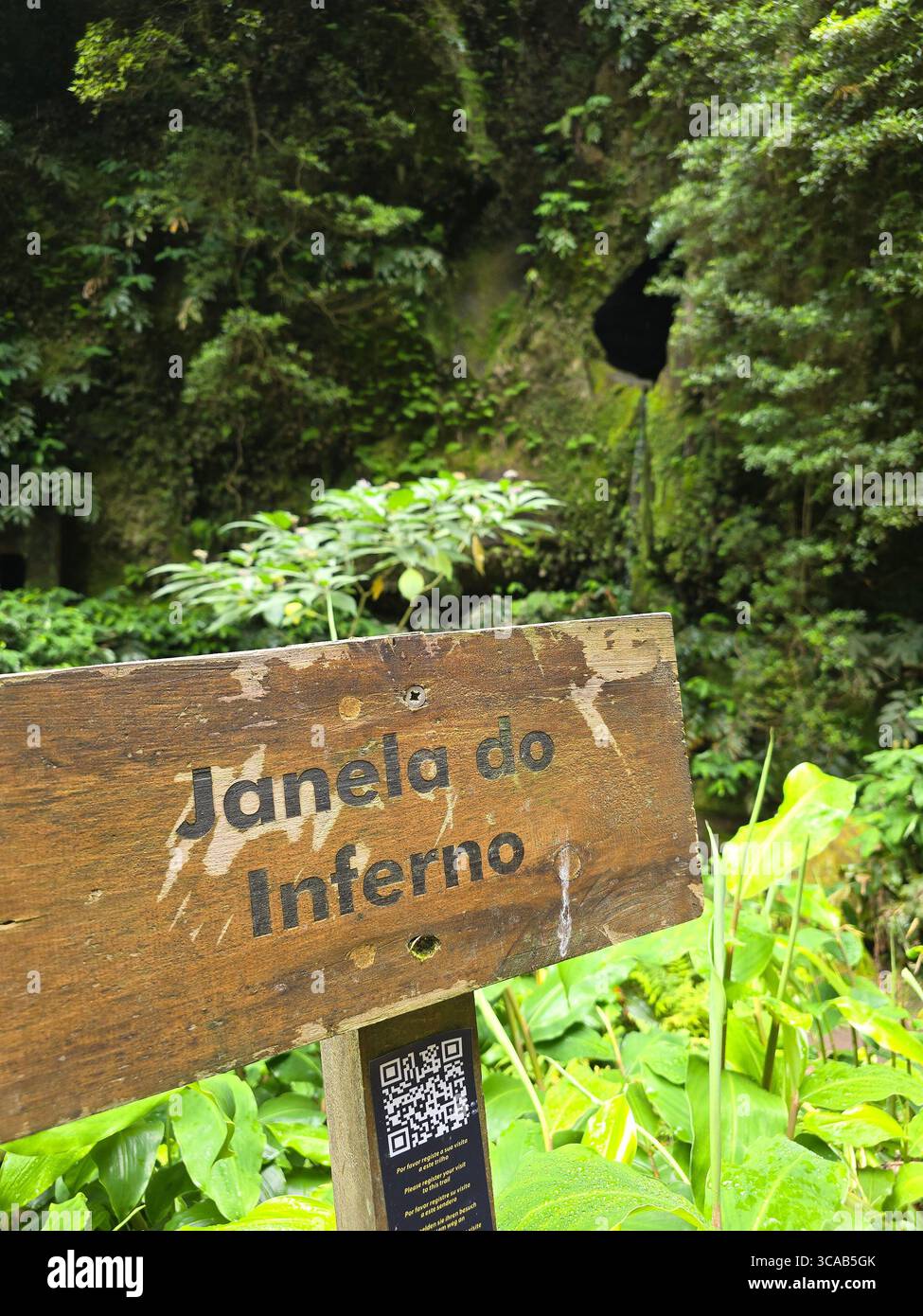 Wooden sign marking Janela do Inferno hiking trail, São Miguel Island, Azores, Portugal. - Smartphone Captured Stock Image