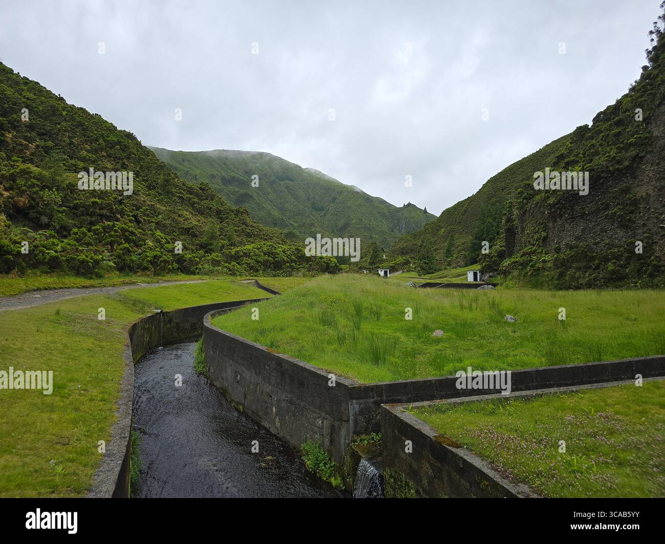 Levada trail and water collection system near Lagoa do Fogo, São Miguel Island, Azores, Portugal. - Smartphone Captured Stock Image