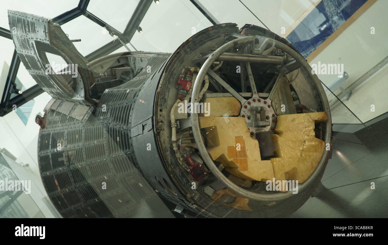 Close-up and full view of an original NASA Gemini spacecraft capsule displayed in a glass exhibit at the California Science Center, showcasing detaile Stock Photo