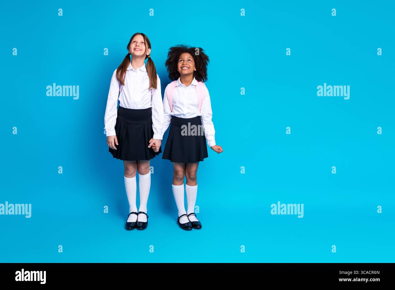 Two schoolgirls in uniforms hi-res stock photography and images - Alamy