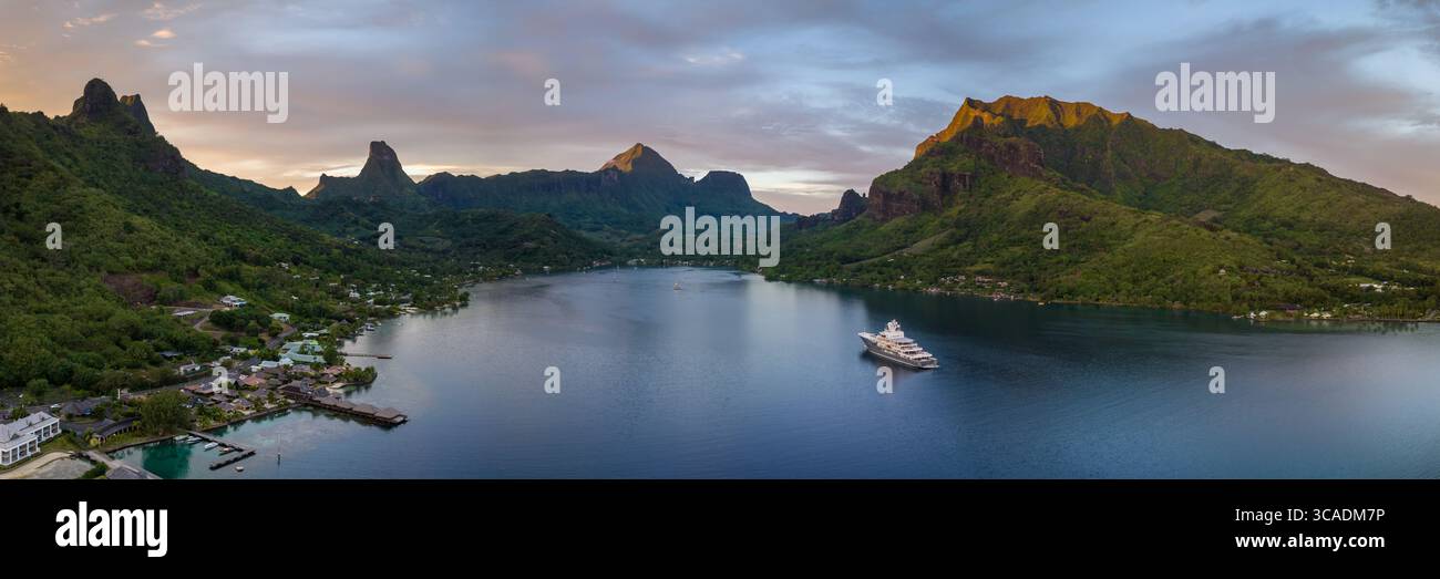 Luxury yacht anchored in Cook's Bay at sunset, Moorea Island, Tahiti ...