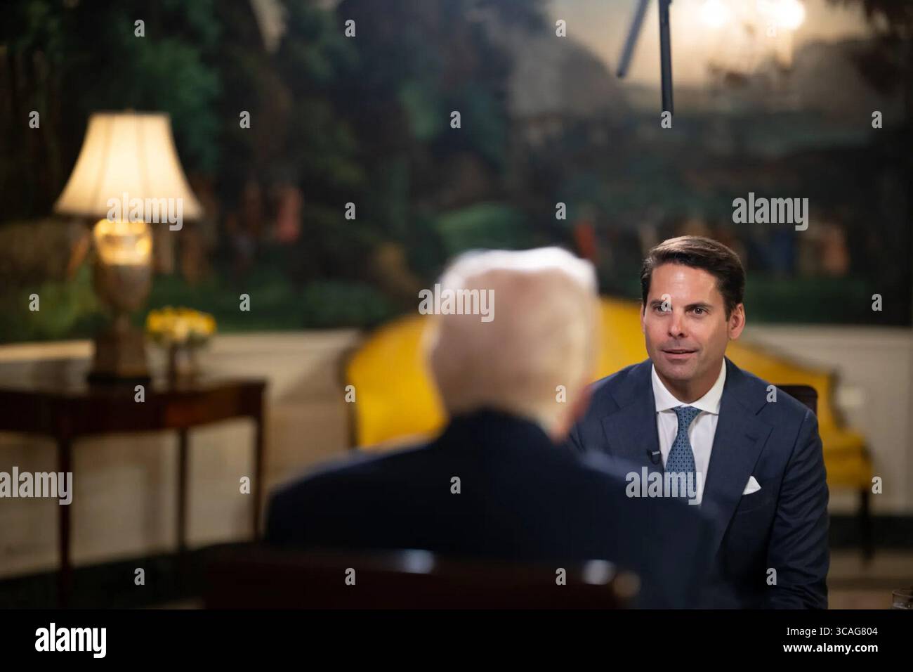 Newsmax anchor Rob Finnerty interviews President Donald Trump at the