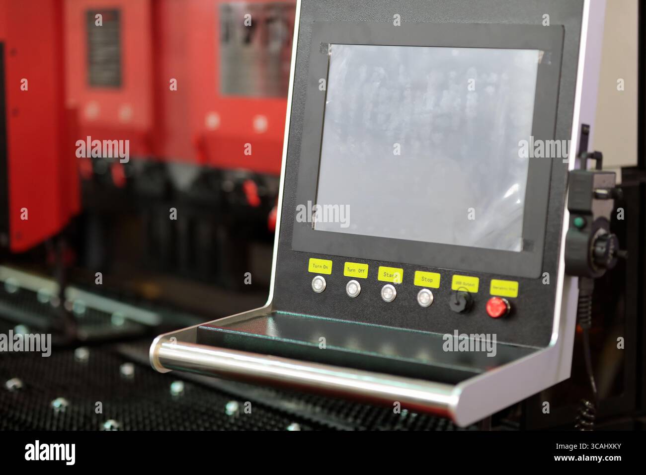 Touch screen control panel of metalworking machine. Selective focus. Stock Photo