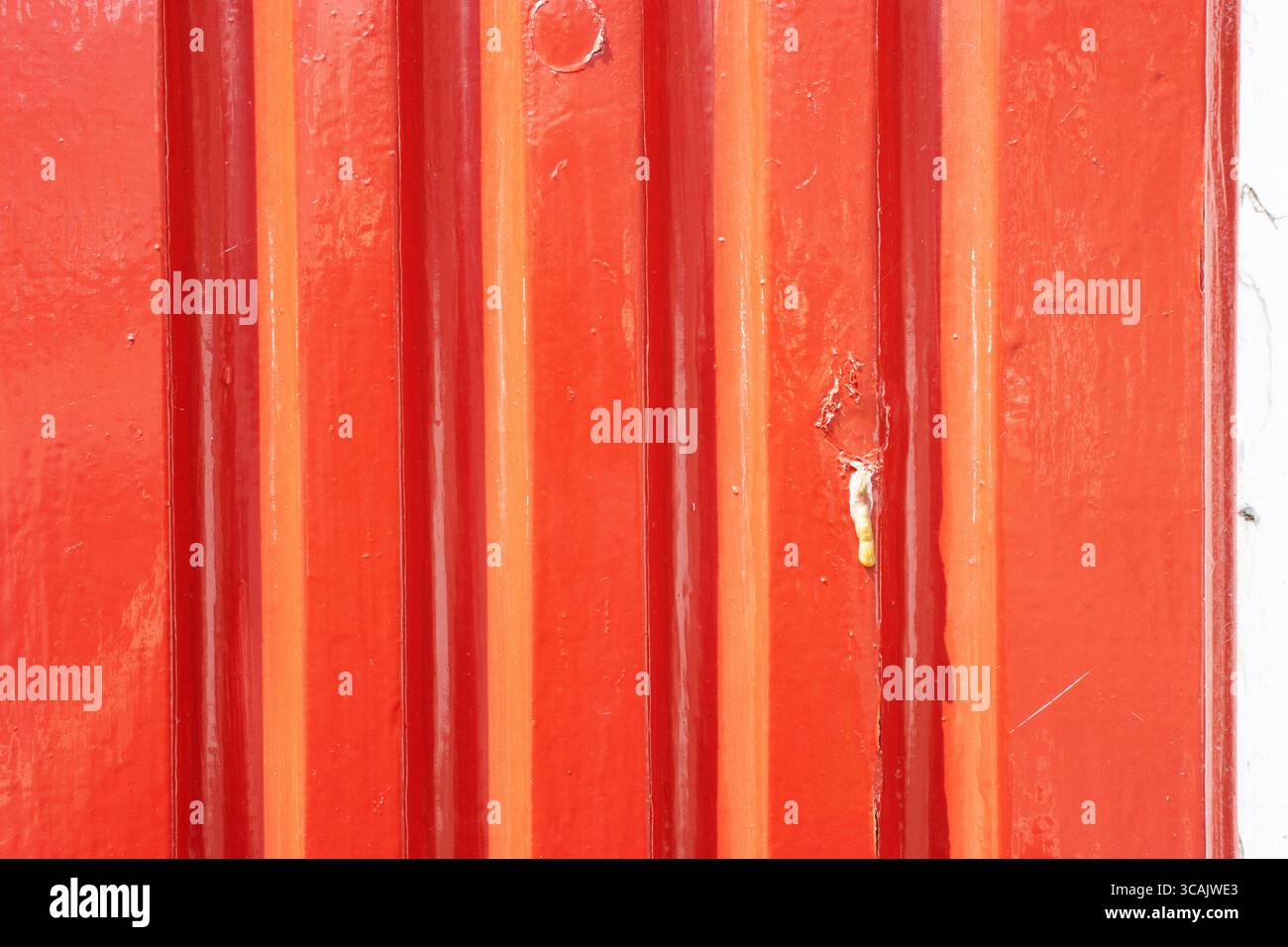 red painted and peeling corrugated iron Stock Photo