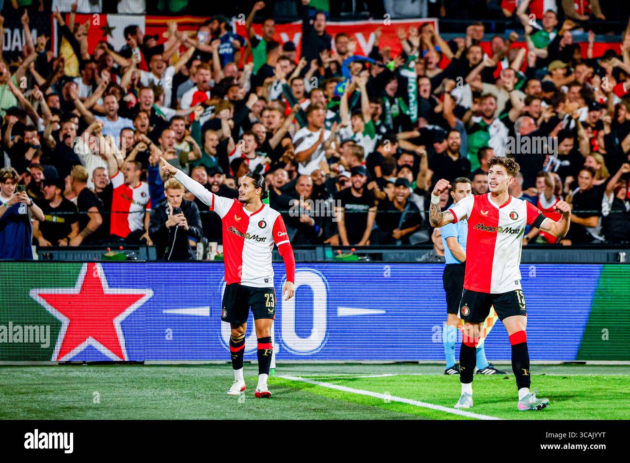 Anis Hadj Moussa of Feyenoord celebrates with Jordan Bos of Feyenoord after scoring his teams second goal during the UEFA Champions League, 3rd Qualif Stock Photo