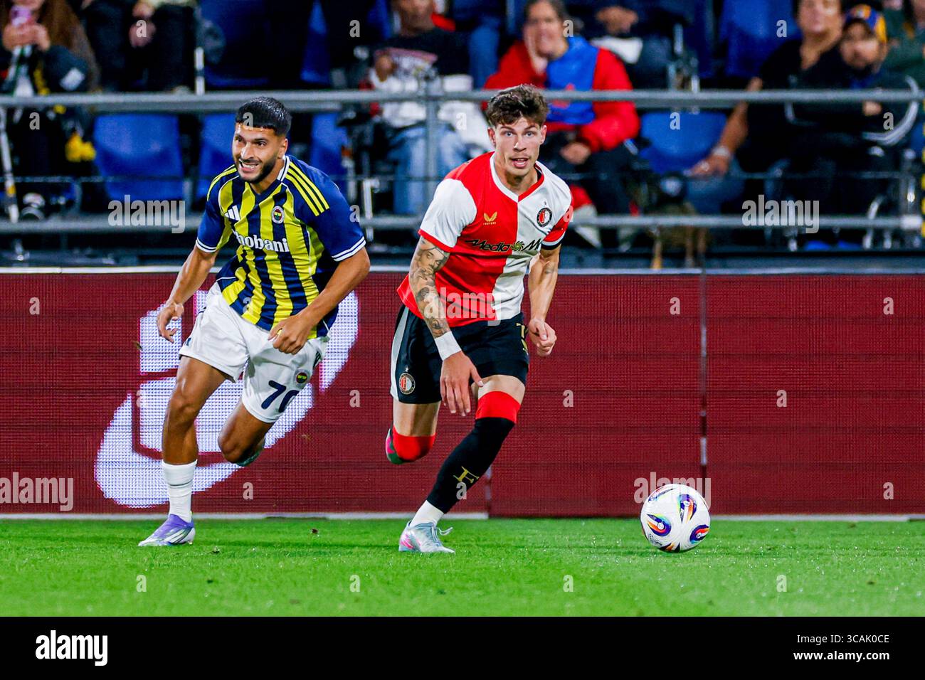 Jordan Bos of Feyenoord dribbles with the ball under pressure from Oğuz Aydın of Fenerbahçe during the UEFA Champions League, 3rd Qualifying Round, 2n Stock Photo