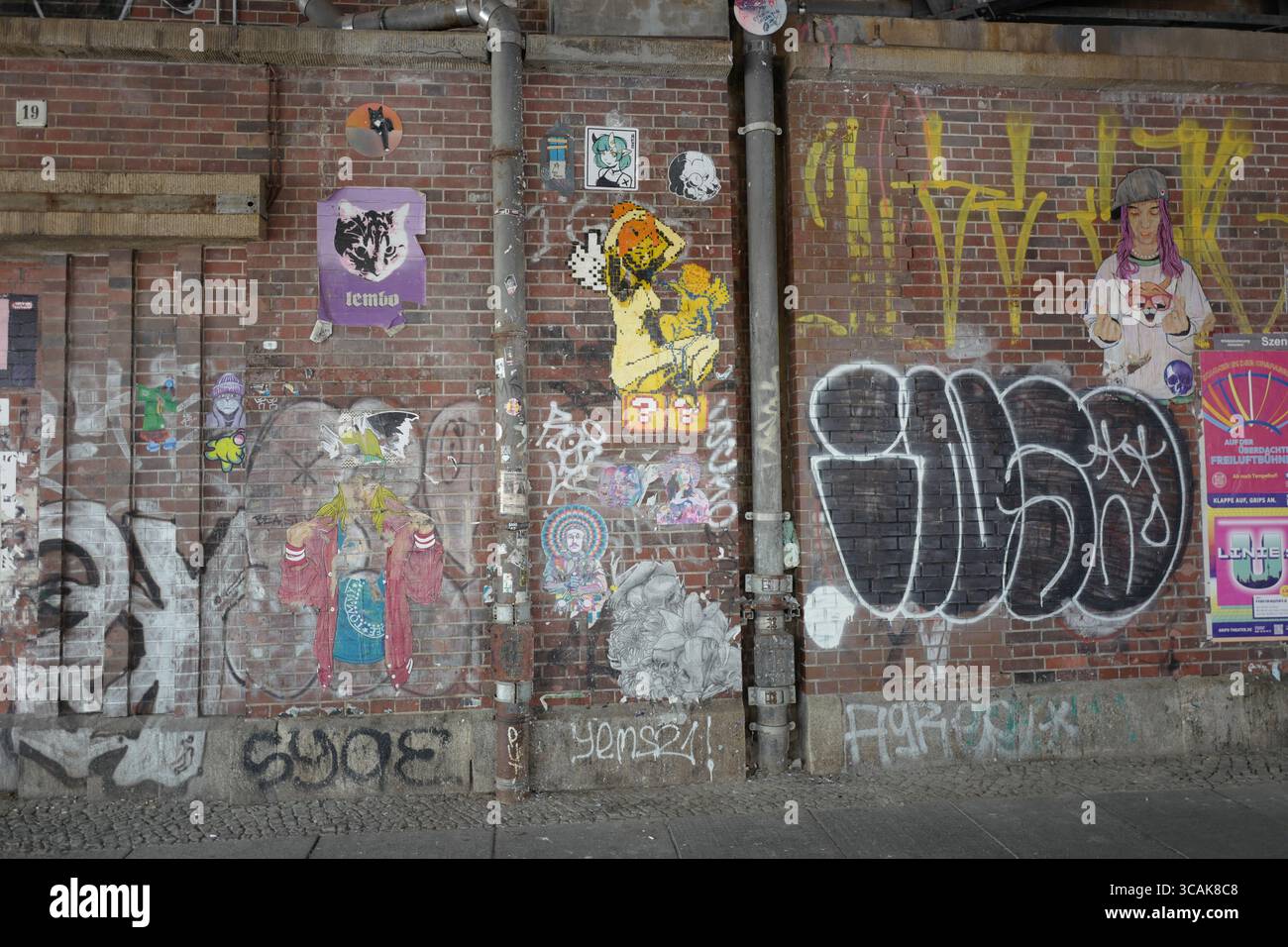 Brick wall with Graffiti in East Berlin Stock Photo
