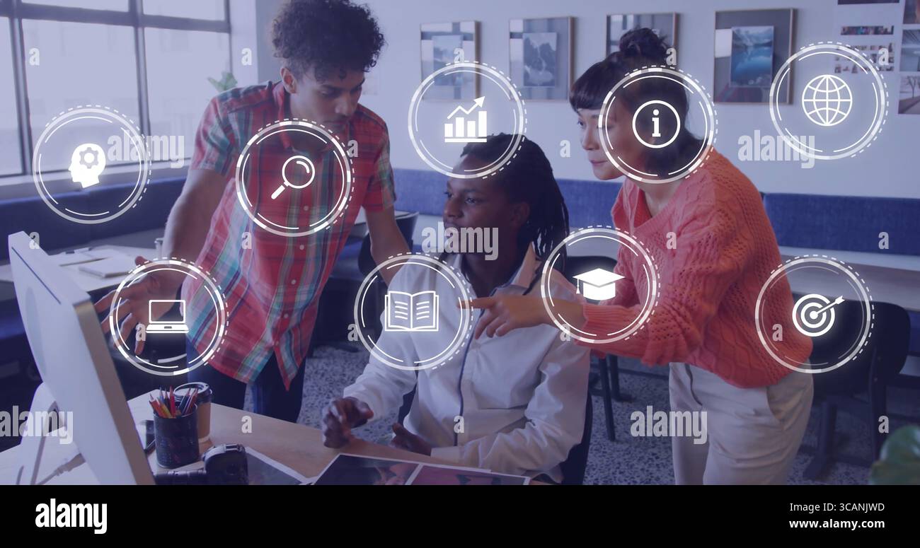 Collaborating three coworkers analyzing data on computer in office workspace, with interface icons Stock Photo