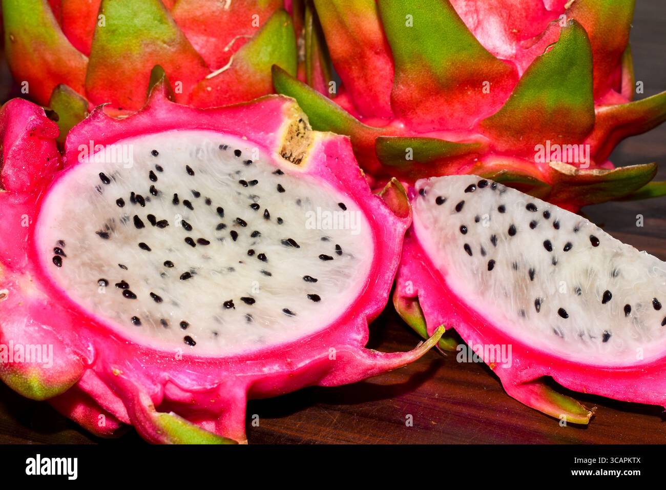 Fresh Dragon ( Pitaya ) fruit on wooden table Stock Photo