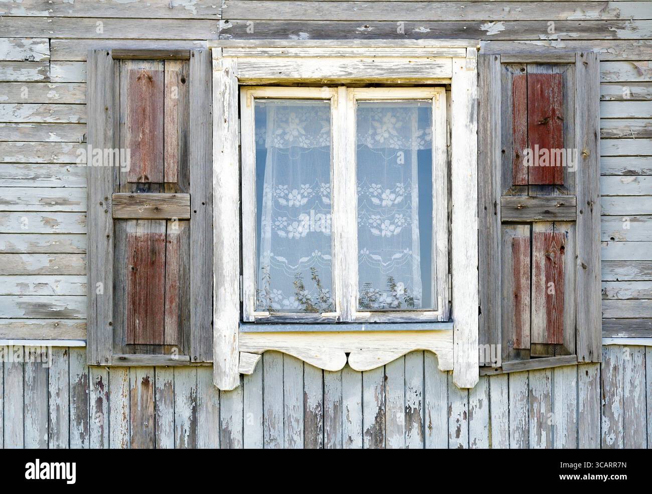 Old dirty white window in the old wooden house texture. The old age ...