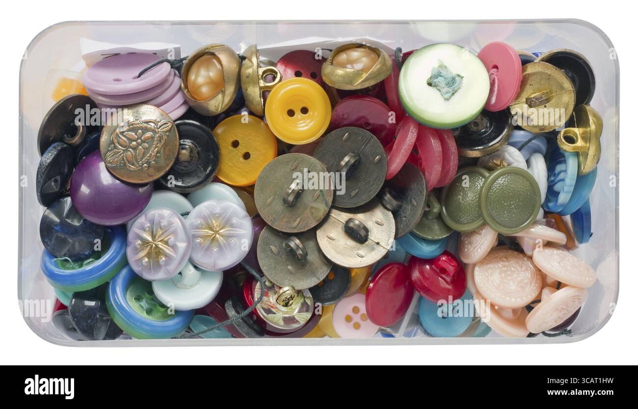 Old dusty vintage plastic buttons for repair of clothes in a box isolated Stock Photo