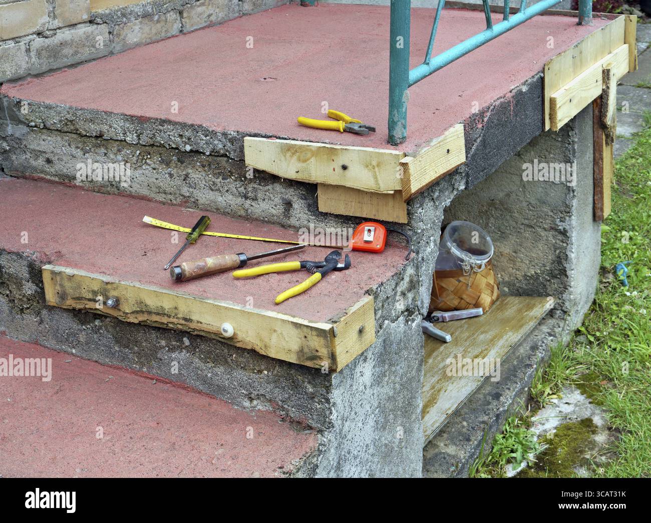 Simple homemade repair of the destroyed concrete porch in a poor rural ...