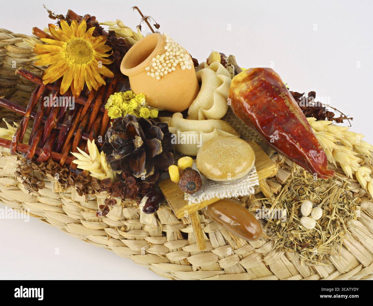 The Ukrainian talisman which calls riches and a prosperity in the house. It is possible to see a tiny fence, a sunflower, a jug, bread, pelmeni, peppe Stock Photo