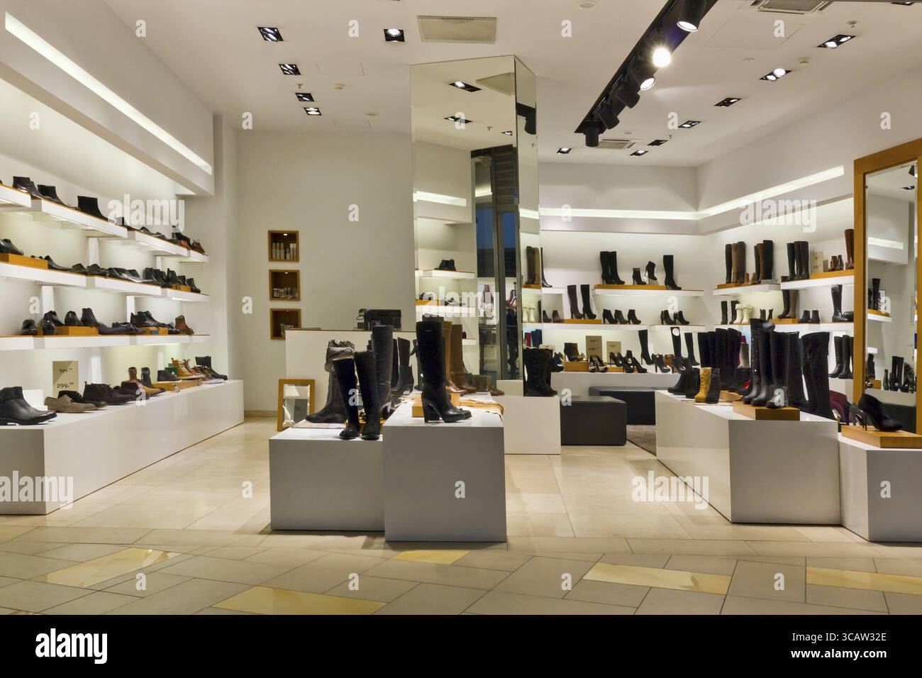 Shoe standart mass production shop - evening lighting, isn't present buyers Stock Photo